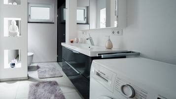 Shower, hair dryer, towels, soap