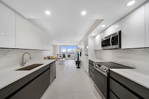Fridge, microwave, oven, stovetop - Bayfront High-Rise Condo | Oceanview | StayCozy (Miami)