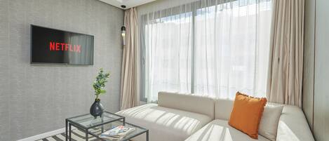 Premium Suite | Living area | 43-inch Smart TV with satellite channels