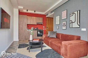 Executive Penthouse | Living area | 43-inch Smart TV with satellite channels