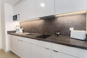 Fridge, microwave, stovetop, coffee/tea maker