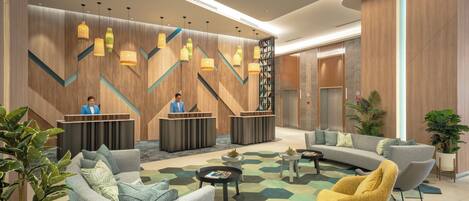 A modern lobby with a reception desk, seating area, and decorative lighting.