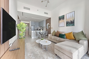 Deluxe Apartment | Living area | 55-inch Smart TV with cable channels, Netflix, streaming services