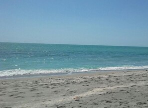 On the beach, sun loungers, beach towels