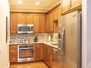 Condo, 2 Bedrooms | Private kitchen | Fridge, oven, coffee/tea maker, toaster