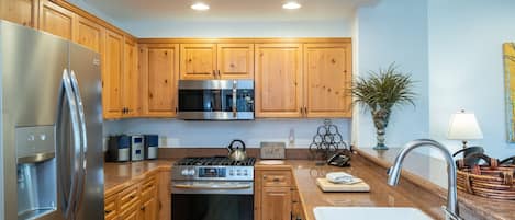 Condo, 2 Bedrooms | Private kitchen | Fridge, oven, coffee/tea maker