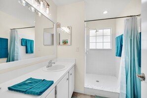 Shower, hair dryer, towels, soap