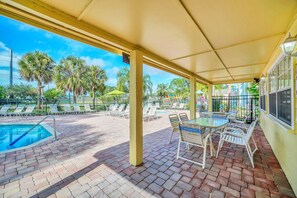 Outdoor pool, a heated pool - 	Resort-Style 3BR Condo (Kissimmee)