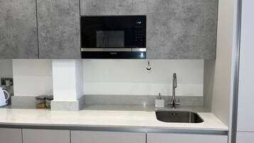 Apartment, 1 Queen Bed | Private kitchen | Fridge, microwave, oven, stovetop