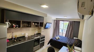 Full-sized fridge, oven, cookware/dishes/utensils, cleaning supplies