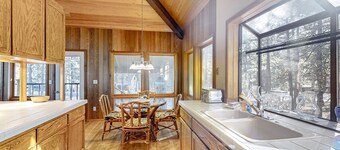 Whimsical tree-lined stay with wood stove, shared amenities, and large deck