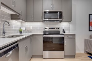 Fridge, microwave, oven, stovetop - Clean spacious Modern Suite With Full Entertainment  (Calgary)