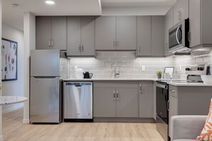 Fridge, microwave, oven, stovetop - Clean spacious Modern Suite With Full Entertainment  (Calgary)
