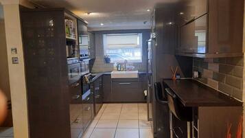 House, Multiple Beds | Private kitchen | Fridge, microwave, oven, stovetop