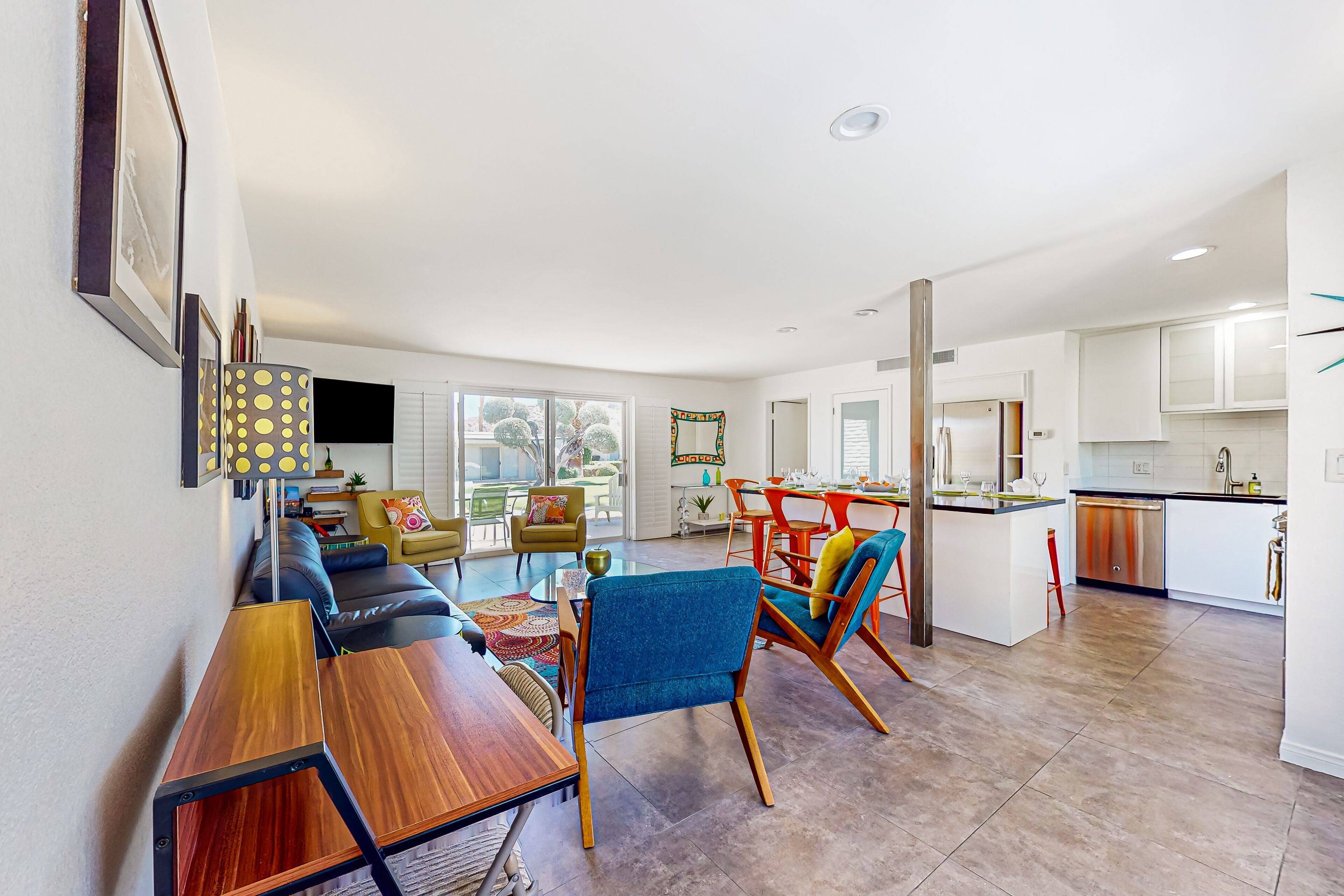 Color-filled charmer with pool & tennis access, patios, and AC