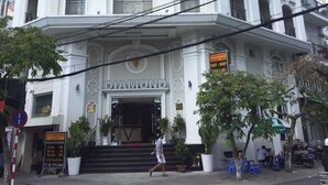 A multi-story hotel with a prominent 'DIAMOND' sign at the entrance. - Diamond Hotel (Ho Chi Minh City)