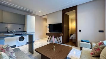 Junior Apartment | Living area | 50-inch flat-screen TV with satellite channels, TV, pay movies