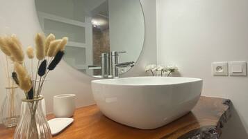 Shower, hair dryer, towels, toilet paper