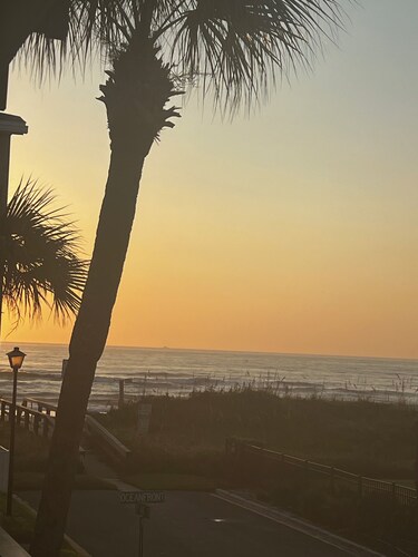 Amazing sunrises & beach views from private balcony & steps from the sand!!