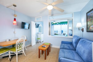 Condo, 1 Bedroom, Oceanfront | Living area | Flat-screen TV