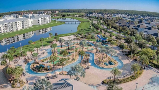 A resort with a golf course, water features, and a pool area. - Special Offer! Frozen Themed Condo on the top floor lake view close to Disney  (Kissimmee)