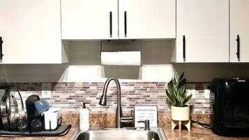 Fridge, oven, stovetop, dining tables