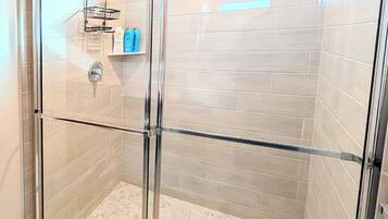 Shower, hair dryer, towels, soap
