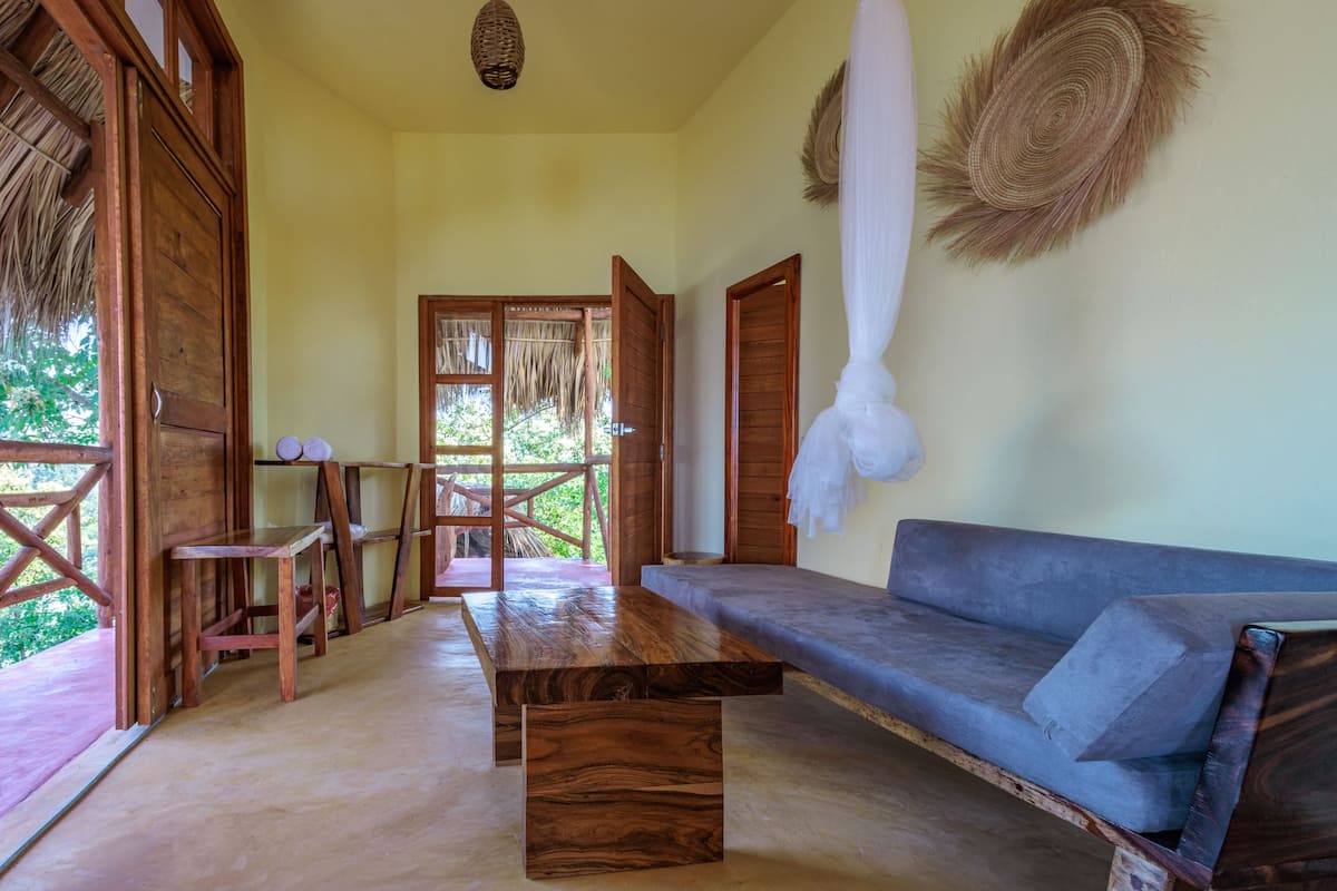 Deluxe Room, 1 Bedroom, Ocean View | Desk, laptop workspace, iron/ironing board, individually decorated