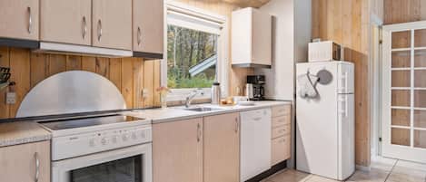 Fridge, stovetop, dishwasher, coffee/tea maker