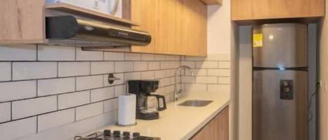 Fridge, microwave, blender, cookware/dishes/utensils