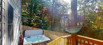 Scenic retreat with private hot tub, fenced yard, fire table, & furnished porch