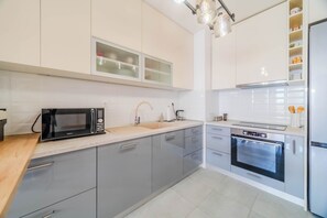 Family Apartment, Multiple Bedrooms (Apartment Saga With Terrace And) | Private kitchen | Fridge, microwave, oven, stovetop - Apartment Saga With Terrace And Parking (Zagreb)
