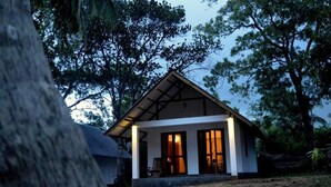 A small, single-story house with a gabled roof, surrounded by trees. - The Countryside Udawalawe (Udawalawa)