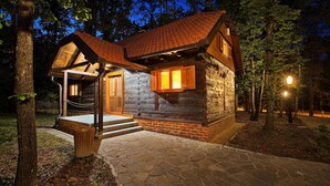 A log cabin with a stone foundation, wooden exterior, and a red-tiled roof. - Gorgeous home in Gustelnica with sauna (Gustelnica)