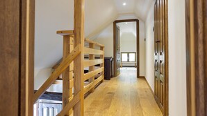 A wooden staircase leading to a second floor with a view of the interior. - Gorgeous home in Gustelnica with sauna (Gustelnica)