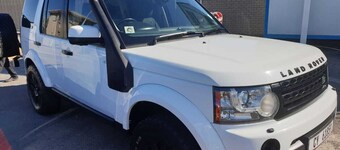 Land Rover Discovery, roof top tent and off road trailer with driver