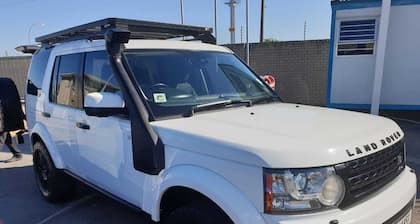 Land Rover Discovery, roof top tent and off road trailer with driver