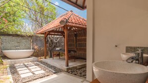 A spa area with a large freestanding bathtub, a wooden gazebo, and a large freestanding basin. - Villa Lotus Kayuputih (Sukasada)