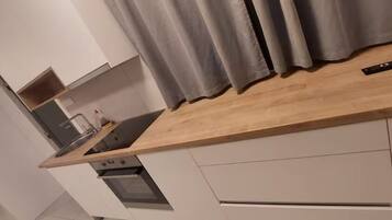 Apartment | Private kitchen | Full-size fridge, oven, cookware/dishes/utensils