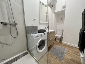 Shower, hair dryer, towels, soap