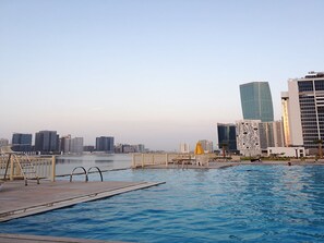 Outdoor pool - Yogi - Incredible 2BR with Balcony and Burj Khalifa Views (Dubai)