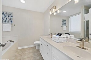 Jetted bath, hair dryer, towels, soap