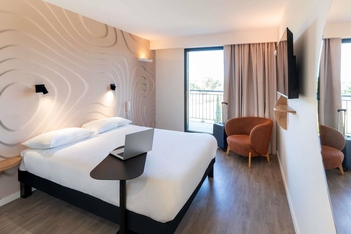Premium bedding, pillow-top beds, desk, laptop workspace