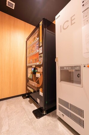Convenient vending machine offers a selection of beverages and snacks.