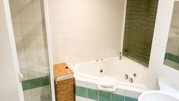Jetted bath, hair dryer, towels, soap