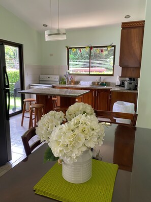 Fridge, microwave, stovetop, coffee/tea maker