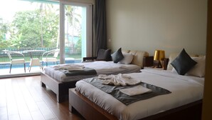 A hotel room with two beds, a balcony with a pool, and a view of greenery. - Psygroover Rococco (Mandrem)