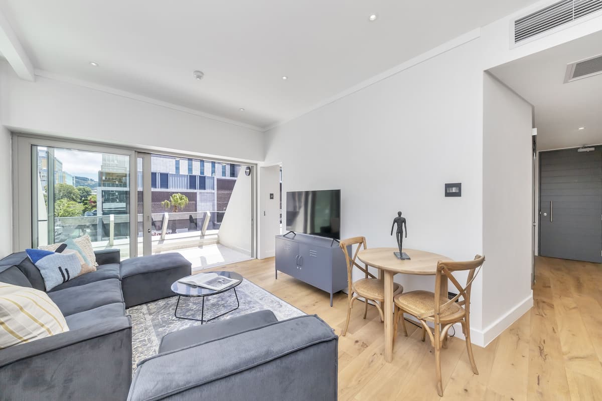 City Apartment | Living area | 32-inch Smart TV with satellite channels