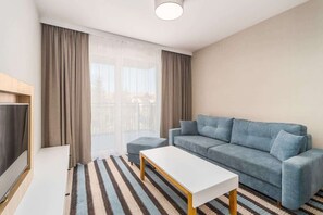 TV - Modern Apartment with Balcony | Close to the Beach and Parking (Miedzyzdroje)