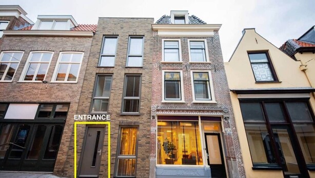 A row of townhouses with a marked entrance. - Divine 50m2 Apartment (WE-39-D) (Tiel)